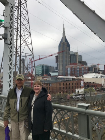 Grandpa & Grandma posing in front of the city skyline