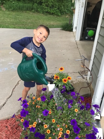 Here I am, Mr. Helpful, watering mom's flowers while she was out of state for a work conference.