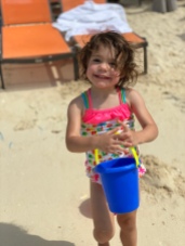 G loved her sand bucket.